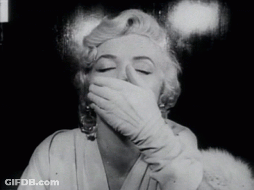 Woman Covering Mouth With White Gloves GIF