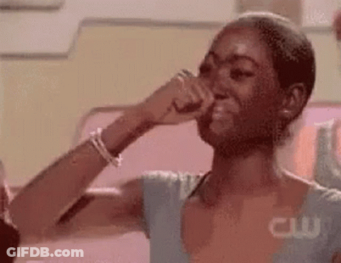 Woman Covering Nose And Laughing GIF
