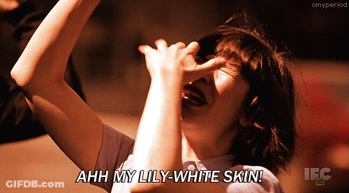 Woman Covering Nose Saying Ahh My Lily White Skin GIF