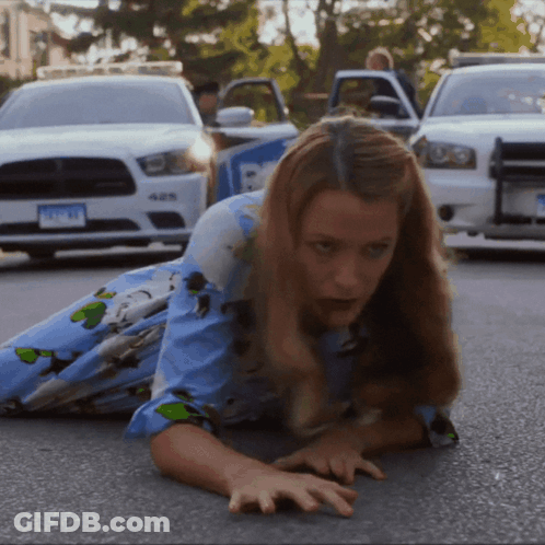 Woman Crawling In Front Of Police Car GIF