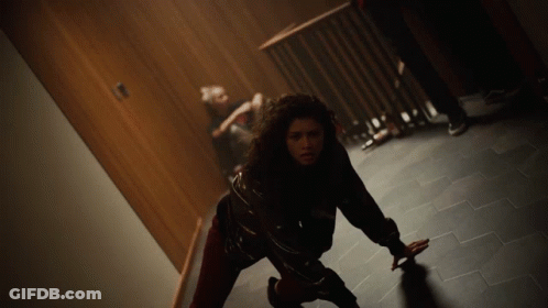 Woman Crawling On Floor In Dark Room GIF