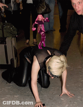 Woman Crawling With Pink Doll On Back GIF