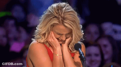 Woman Crying At Microphone In Front Of Crowd GIF