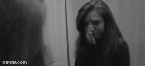 Woman Crying Covering Face GIF