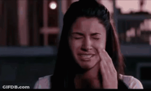 Woman Crying Covering Face With Hands GIF