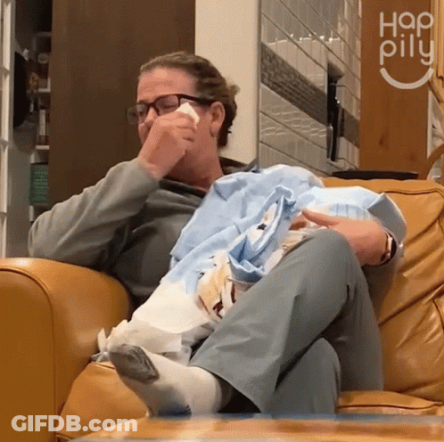 Woman Crying Holding Baby In Front Of Hap Pilu Sign GIF