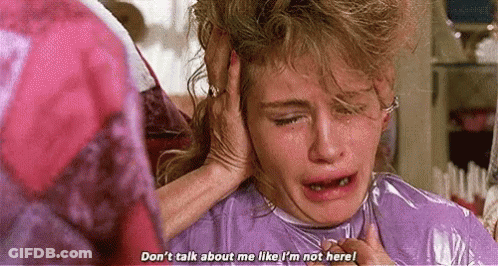 Woman Crying Holding Head While Another Listens GIF