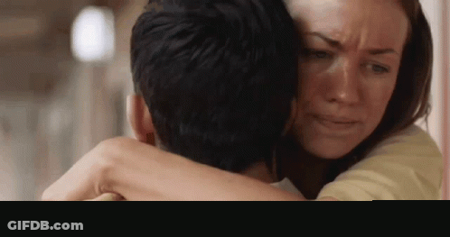 Woman Crying Hugging Man GIF