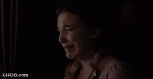 Woman Crying In Dark Room Looking Out Window GIF
