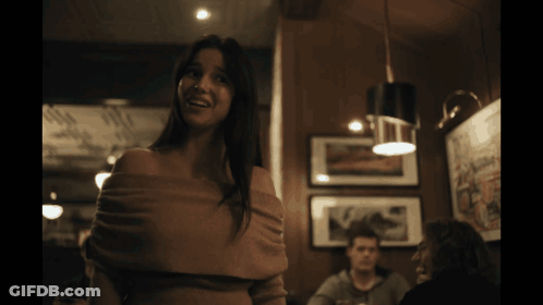 Woman Crying In Dark Room With Man At Table GIF