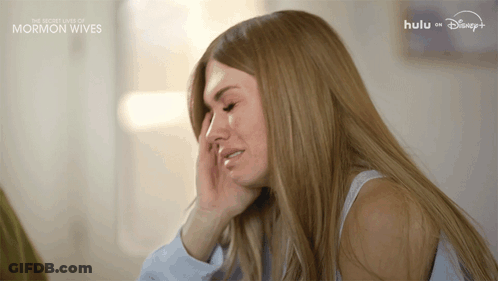 Woman Crying In Front Of Hulu Sign GIF