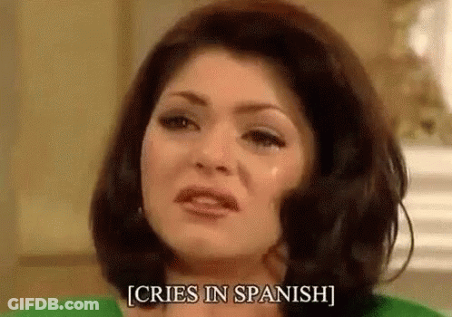 Woman Crying In Spanish In Green Shirt And Green Sweater GIF
