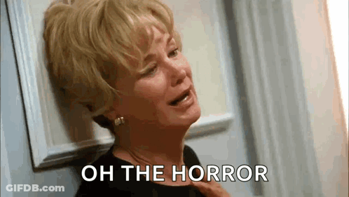 Woman Crying Leaning Against Wall Oh The Horror GIF