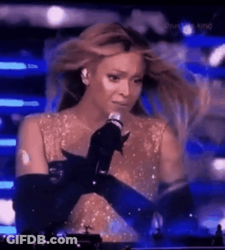Woman Crying While Singing Into Microphone GIF