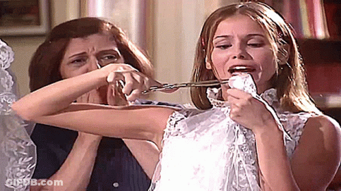 Woman Cutting Bride's Arm With Scissors GIF