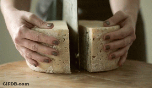 Woman Cutting Cheese In Half GIF