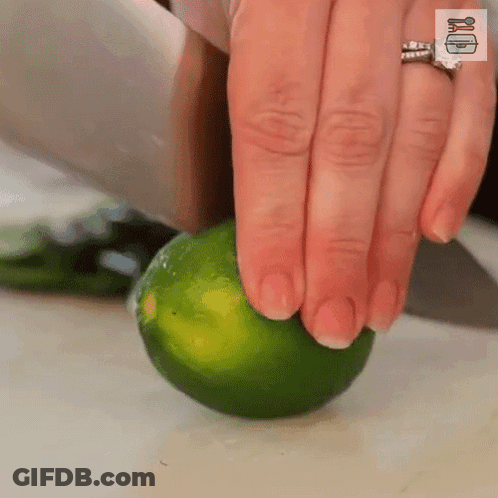 Woman Cutting Lime With Knife GIF