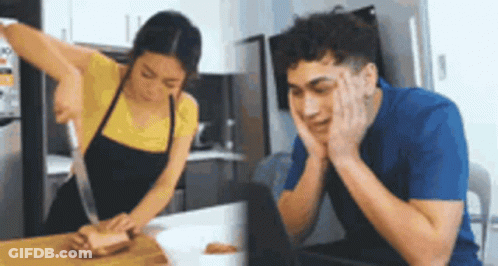 Woman Cutting Meat Man At Laptop GIF