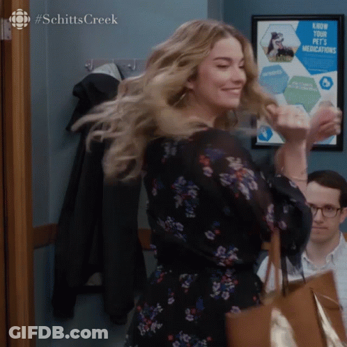 Woman Dancing By Know Your Pets Medications Sign GIF