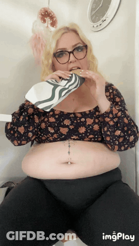 Woman Dancing By Tanzen's Sign GIF