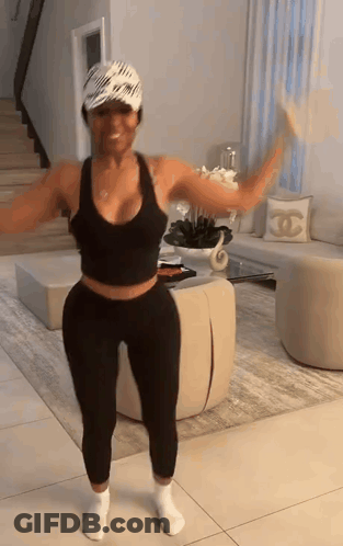 Woman Dancing In Black Tank Top And Leggings GIF