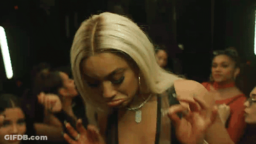 Woman Dancing In Club With Group GIF