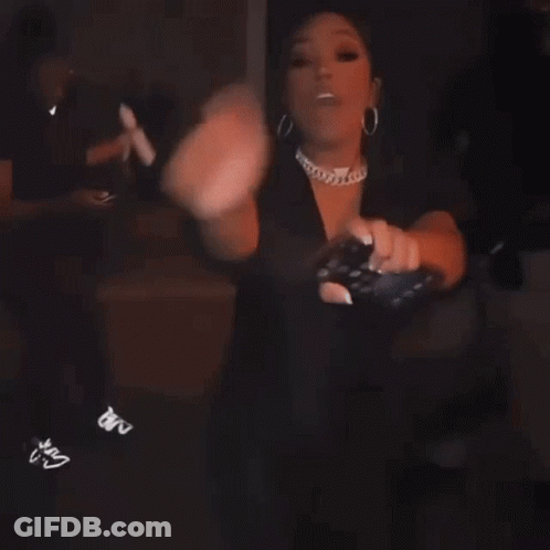 Woman Dancing In Dark Room Holding Cell Phone GIF