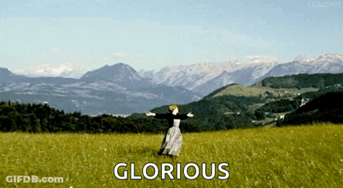Woman Dancing In Field With Glorious GIF