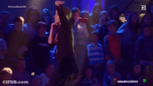 Woman Dancing In Front Of Crowd GIF