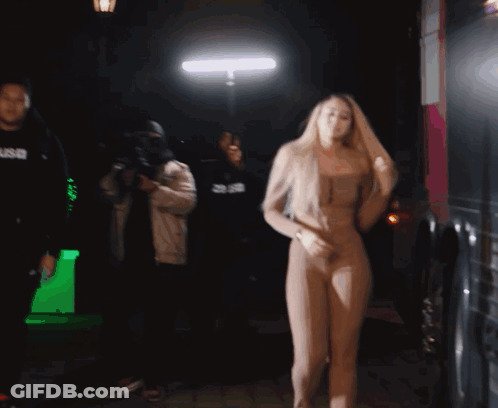 Woman Dancing In Front Of Man In SNB Hoodie GIF