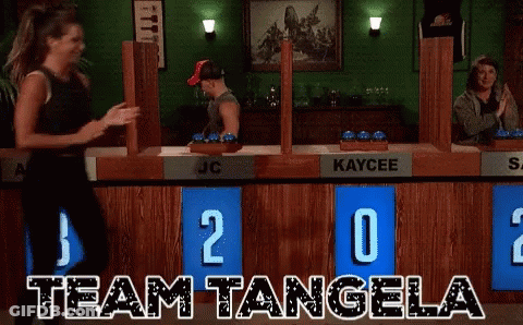 Woman Dancing In Front Of Team Tangela Scoreboard GIF