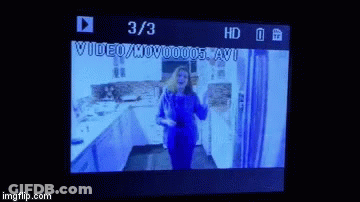 Woman Dancing In Kitchen With 3/3 On Screen GIF