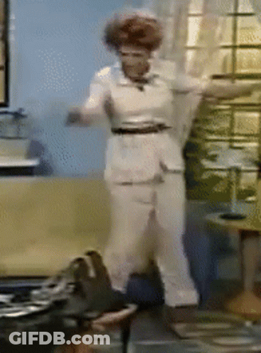 Woman Dancing In Living Room In Front Of Window GIF