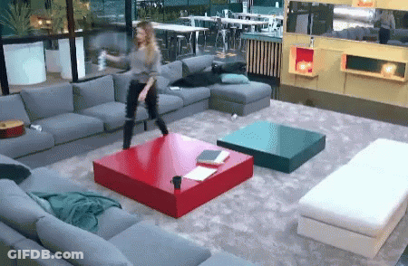 Woman Dancing In Living Room With Red Table GIF
