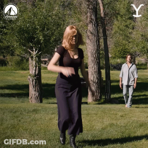 Woman Dancing In Park With Paramount Logo GIF