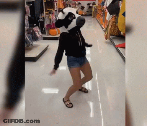 Woman Dancing In Store With Panda Mask GIF