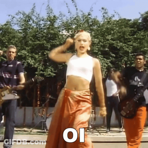 Woman Dancing In White Crop Top And Orange Skirt GIF
