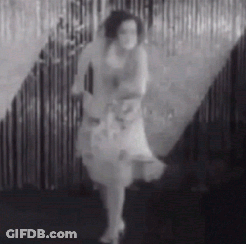 Woman Dancing In White Dress GIF