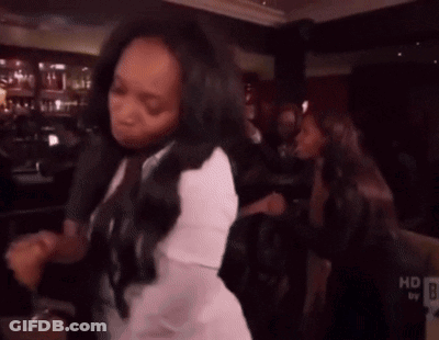 Woman Dancing In White Shirt Near HD Sign GIF