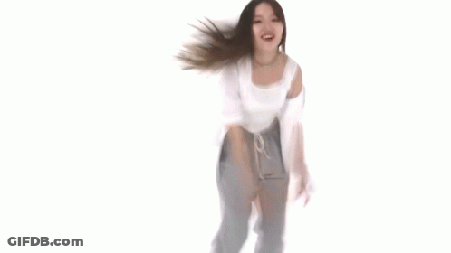 Woman Dancing In White Top And Gray Pants GIF