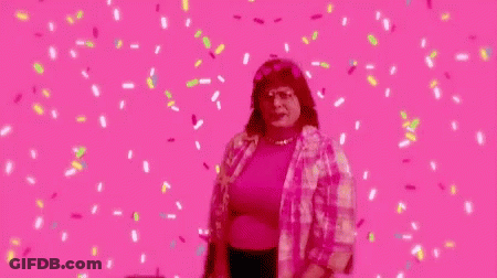 Woman Dancing On Pink Background With Confetti GIF