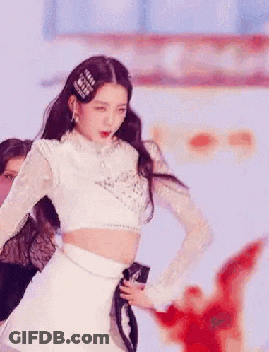 Woman Dancing On Stage In White Crop Top And Skirt GIF