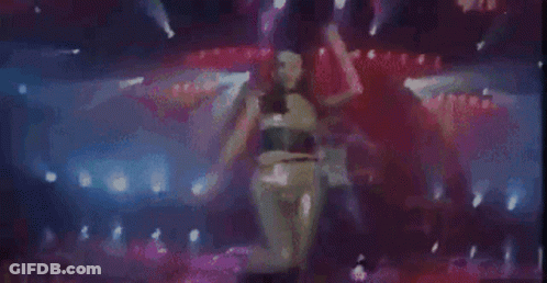 Woman Dancing On Stage With Purple Lights GIF