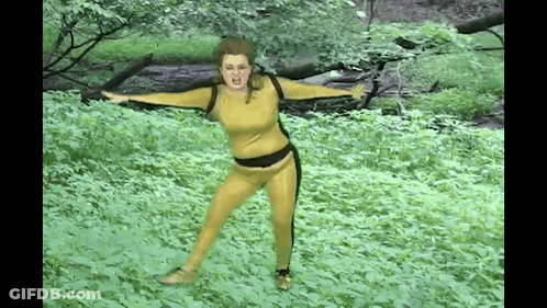 Woman Dancing With Crossed Legs In Crop Top GIF