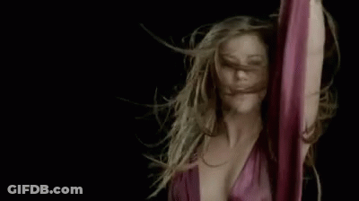 Woman Dancing With Hair Blowing In Wind GIF