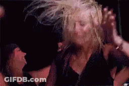 Woman Dancing With Hair Blowing In Wind GIF