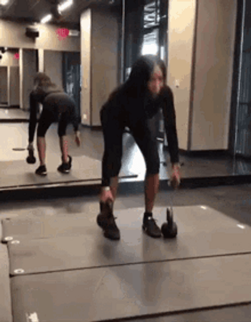 Woman Deadlifting With Mirror GIF