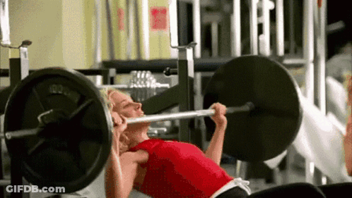 Woman Doing Bench Press In Gym GIF