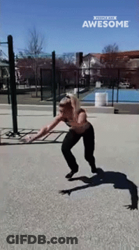 Woman Doing Skateboard Trick In Park Saying Awesome GIF