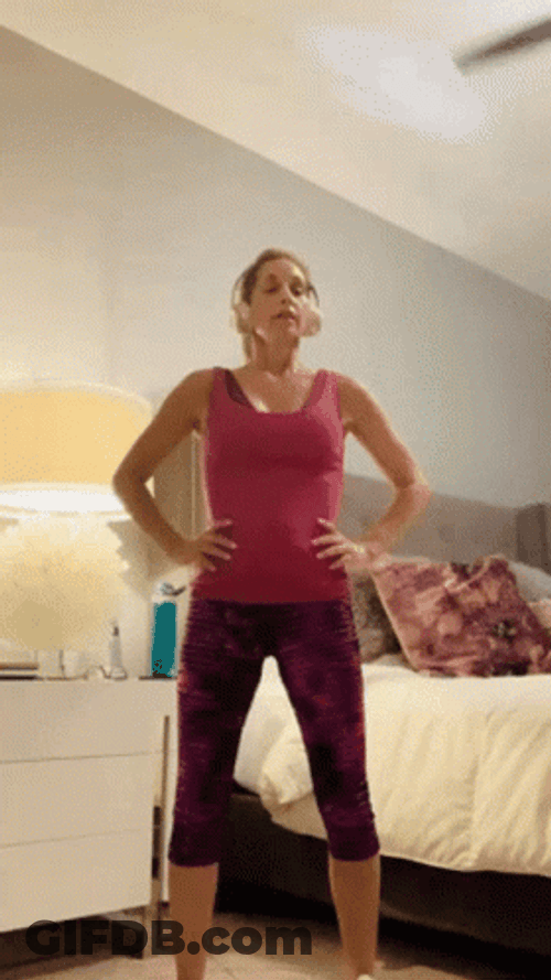 Woman Doing Squat Jump For Good Morning Exercise GIF